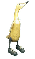 Large wooden duck with shoes