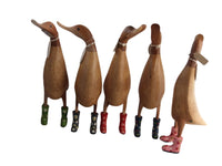 Wooden duck with floral wellies