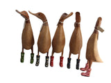 Wooden duck with floral wellies